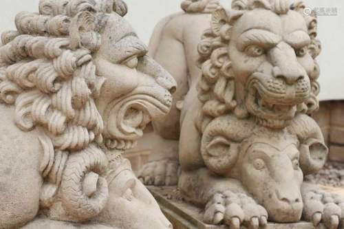 A pair of composite stone lions,