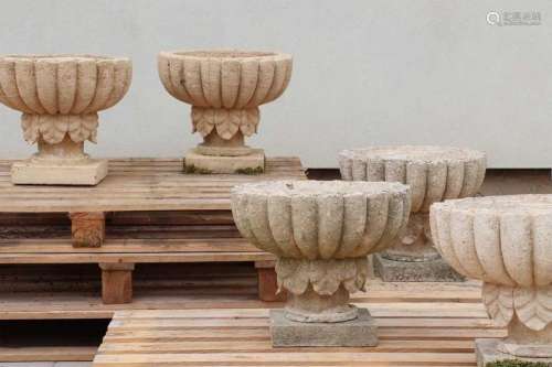 A set of six composition stone garden urns,