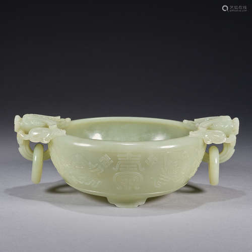 A dragon-handled jade bowl, Qing dynasty