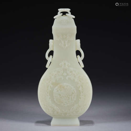 A handled jade relief-carved vase with cover, Qing dynasty