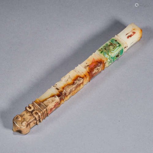 A turquoise-inlaid jade stick, Warring States