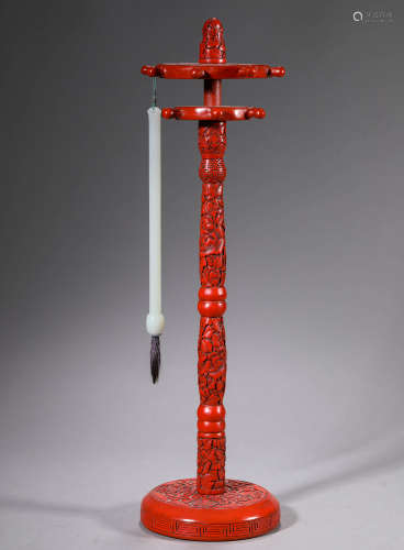A red acquer wood stand and jade writting brush,Qing dynasty