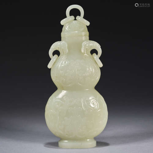 A white jade 'daji' 'double-gourd' vase and cover Qing dynas...