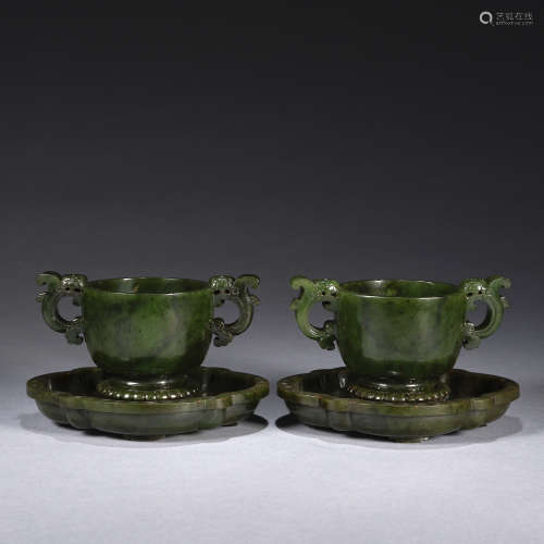 A pair of spinach-green jade 'chrysanthemum' cup and plate g...
