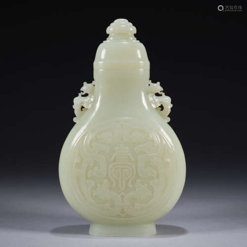 A finely carved jade 'Phoenix and longevity' vase ,Qing dyna...