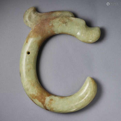 An important celadon jade ‘C-shaped' 'dragon' pendant Neolit...