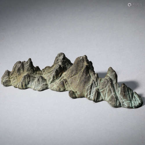 A copper mountain-shaped brush rest, Qing dynasty