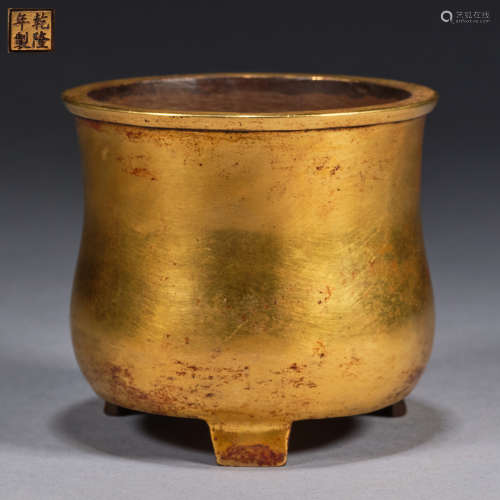 A gilded copper tripod incense burner, Qing dynasty,Qianlong