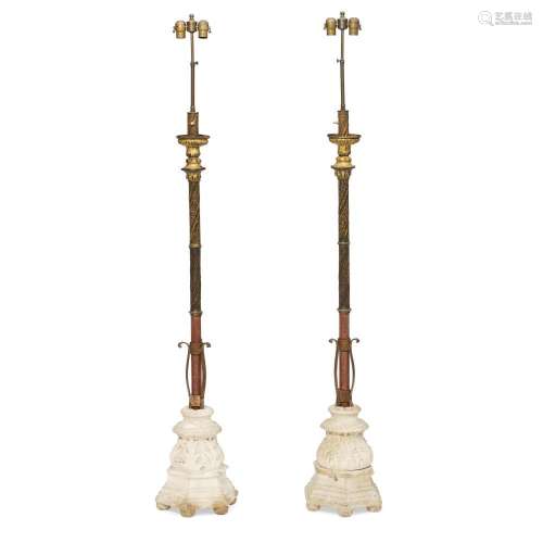 A PAIR OF ITALIAN BAROQUE GILT METAL AND CARVED STONE TORCHÈ...