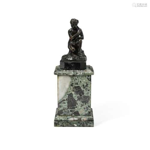 A SMALL PATINATED BRONZE FIGURE OF A CROUCHING VENUSAfter th...