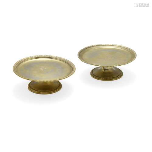 A PAIR OF GEORGE II SILVER-GILT FOOTED CAKE STANDS by Paul C...