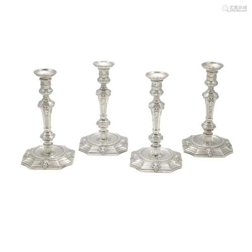 A SET OF FOUR GEORGE II SILVER CANDLESTICKS by Edward Feline...