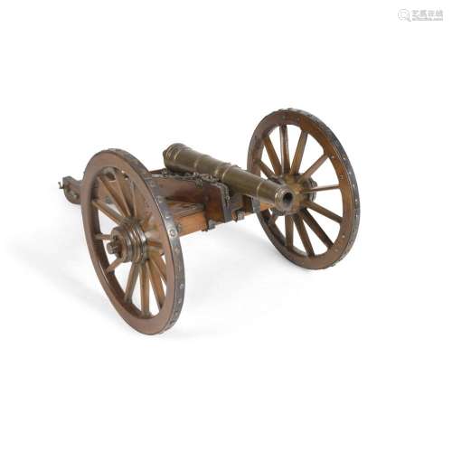 A WOOD AND BRASS MODEL OF A CANNON AND CART
