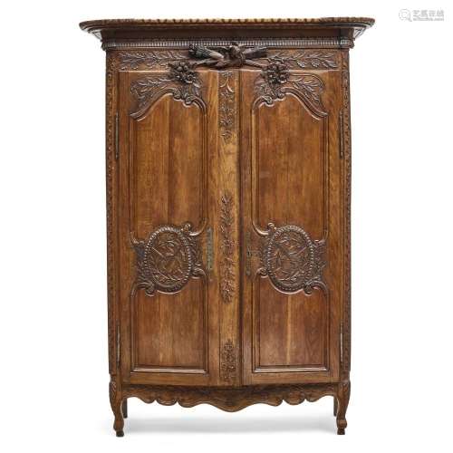 A LOUIS XV STYLE CARVED WALNUT ARMOIRE19th century