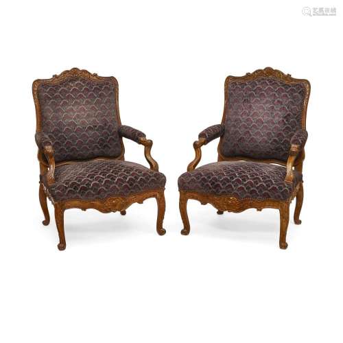 A PAIR OF LOUIS XV STYLE UPHOLSTERED WALNUT FAUTEUILS20th ce...