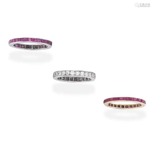 TWO RUBY ETERNITY RINGS; ONE DIAMOND ETERNITY RING  (3)