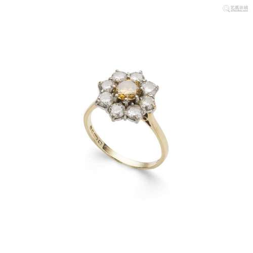 A fancy yellowish-orange and colourless diamond cluster ring