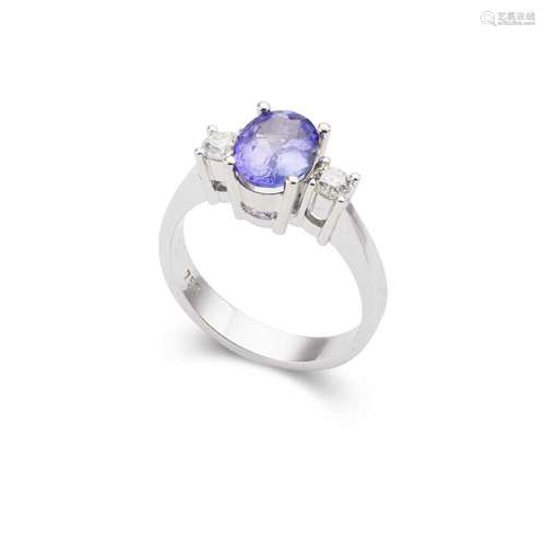 A Tanzanite and diamond three-stone ring