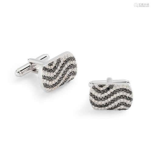 A pair of black and colourless diamond cufflinks