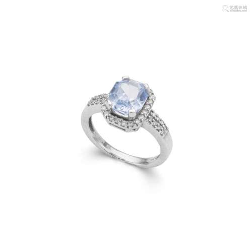 A blue spinel and diamond cluster ring