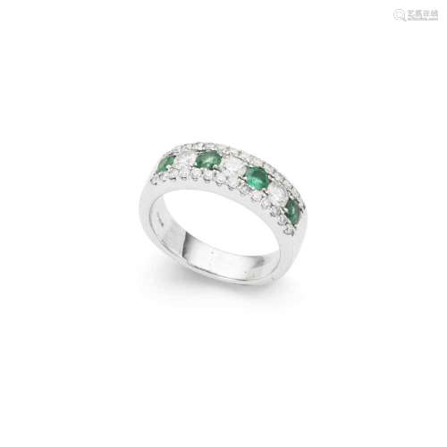 An emerald and diamond half-eternity ring