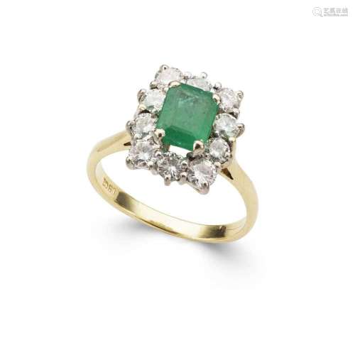 An emerald and diamond cluster ring