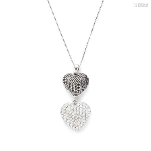 A black and colourless diamond heart pendant