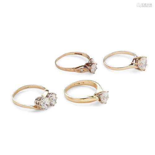 A collection of four imitation diamond rings