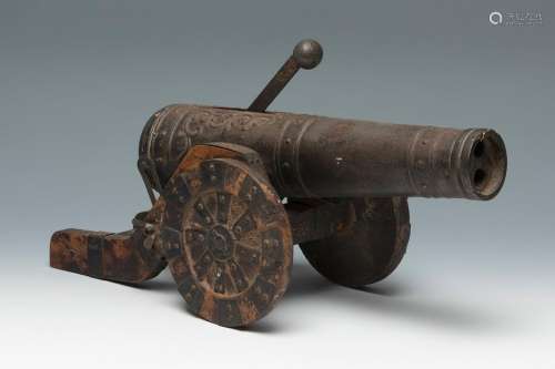 Toy cannon of the XIX century.Painted wood and metal.Lack of...