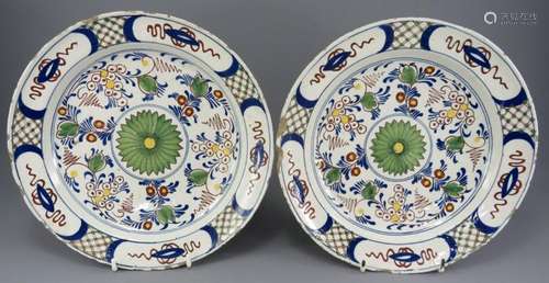 A pair of mid-eighteenth century hand-painted Dutch delft ti...