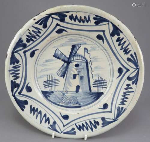 A mid-eighteenth century hand-painted blue and white tin gla...