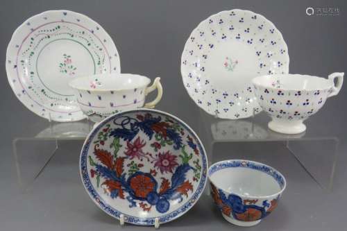 Two early nineteenth century porcelain hand-painted cups and...