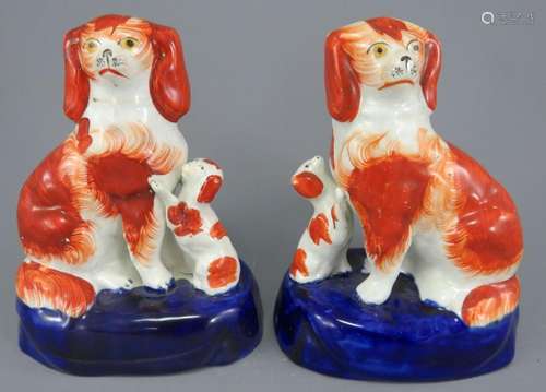 A pair of mid-nineteenth century Staffordshire spaniels with...