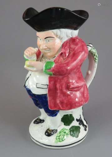 An early nineteenth century pearlware Scottish toby jug, c. ...