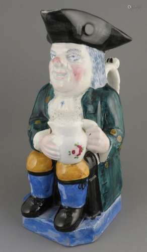An early nineteenth century pearlware toby jug, c. 1840. It ...