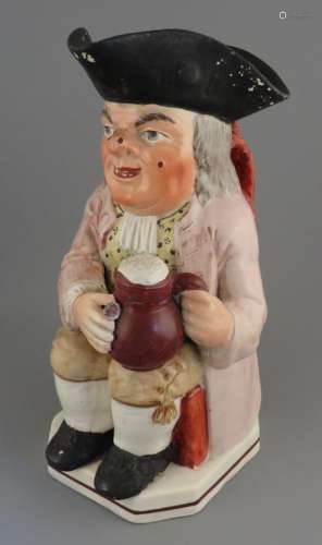 An early nineteenth century pearlware toby jug, c. 1800-20. ...