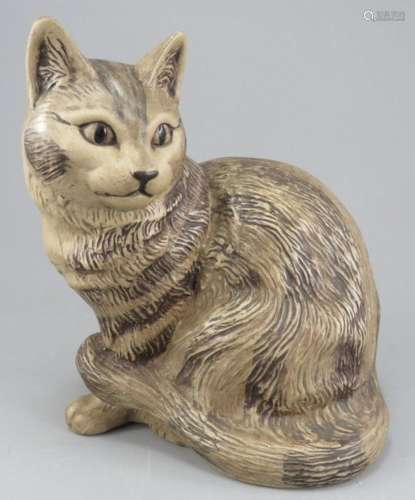 An early twentieth century Poole Pottery cat figure. It is m...