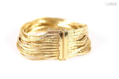 Bracelet souple en or jaune (750) à multiples rangs articulé...
