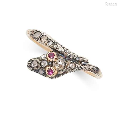 AN ANTIQUE DIAMOND AND RUBY SNAKE RING in yellow gold and si...