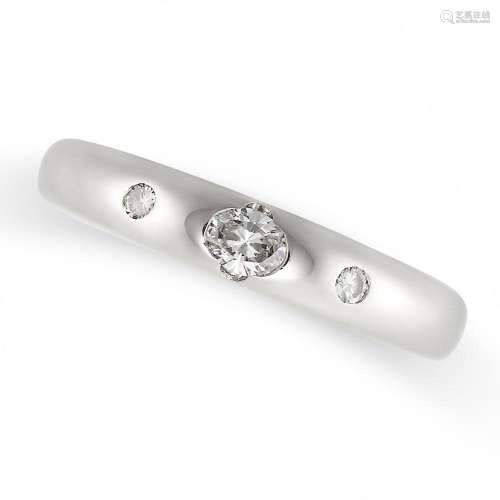A DIAMOND BAND RING in 18ct white gold, set with an oval cut...