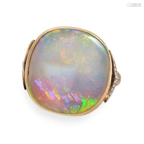 AN OPAL RING in yellow gold, set with an opal slice, no assa...