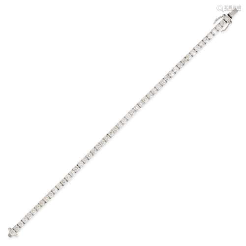 A DIAMOND LINE BRACELET in 18ct white gold, comprising a sin...