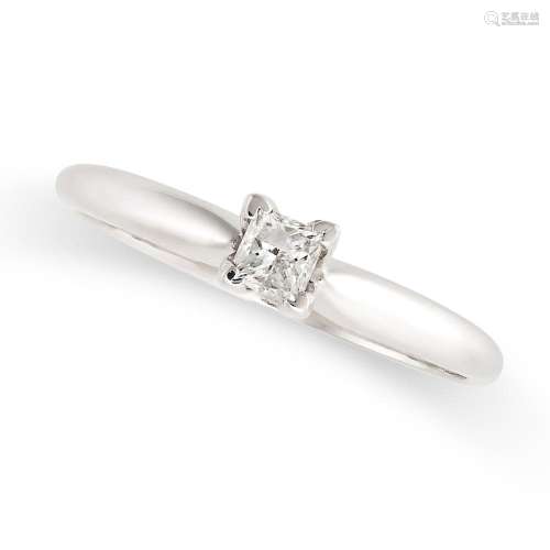 A SOLITAIRE DIAMOND RING in 14ct white gold, set with a prin...
