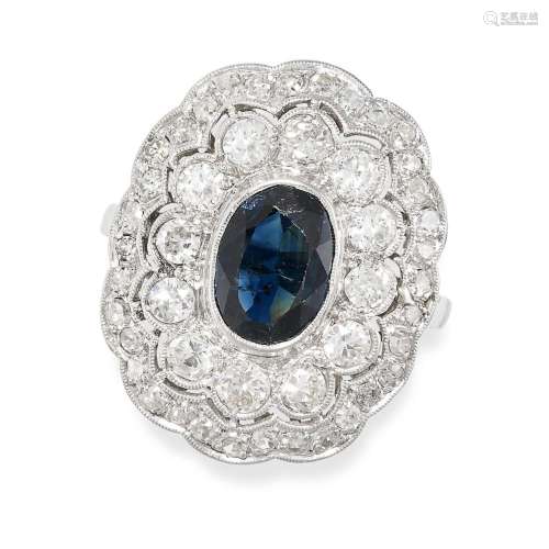 A SAPPHIRE AND DIAMOND RING in platinum, set with an oval cu...