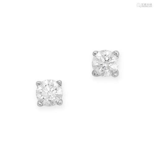 A PAIR OF DIAMOND STUD EARRINGS in white gold, each set with...