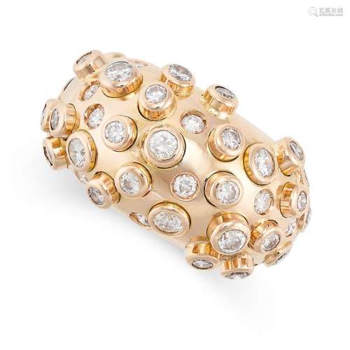 A DIAMOND BOMBE RING in yellow gold, set with round brillian...