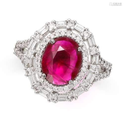 A RUBY AND DIAMOND CLUSTER RING in 14ct white gold, set with...