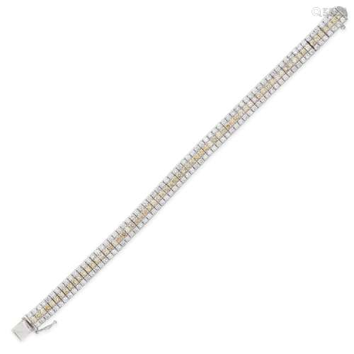 A YELLOW AND WHITE DIAMOND BRACELET in platinum, comprising ...