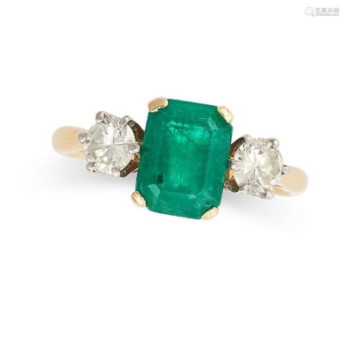 AN EMERALD AND DIAMOND THREE STONE RING in 18ct yellow gold,...