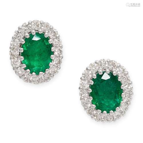 A PAIR OF EMERALD AND DIAMOND STUD EARRINGS each set with an...